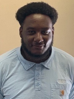 Anfernee McClain smiles for his headshot.