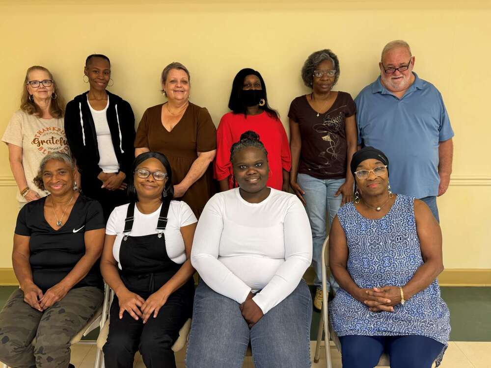 Top row left to right: teacher Kimberly Rousseau, Natasha Leonard, Victoria Kerske, Lottie Curry, Charlotte Harris, and teacher Kent Merrill. Bottom row left to right: Linda Brown, Becky Walker, Lovely Smedley, and Savaria Williams.